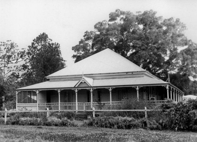 A picture of a house with a pointed roof and a wide verandah in Landsborough